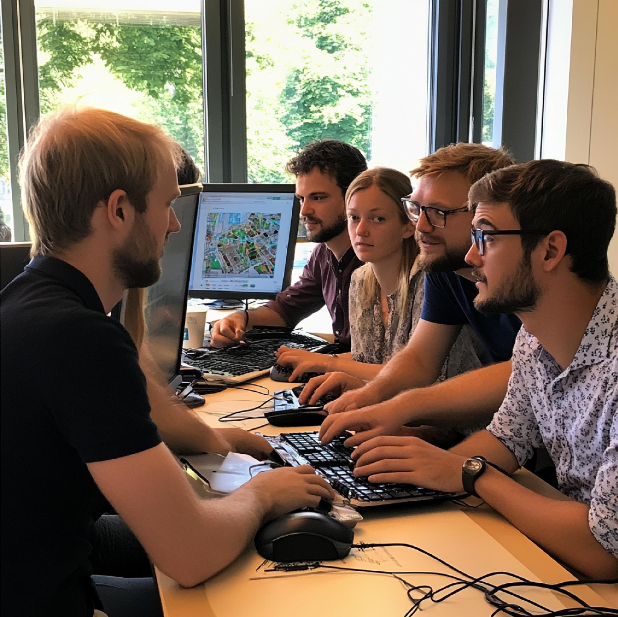 Team member showing game build on laptop